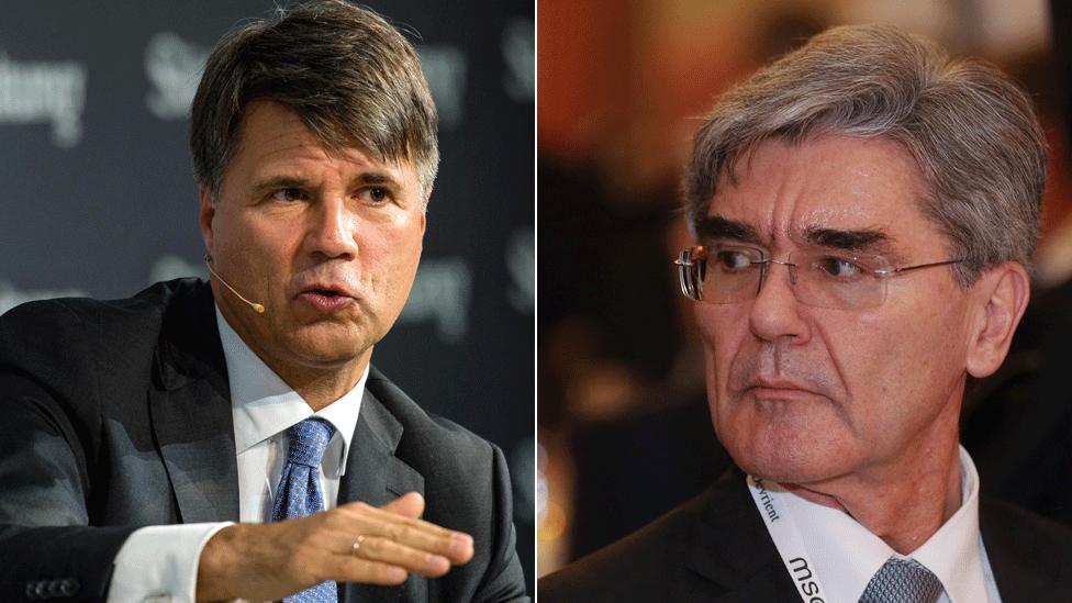 BMW's Harald Krueger (L) and Joe Kaeser, CEO of Siemens