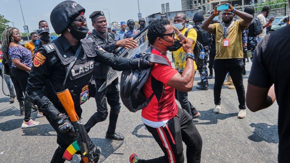 A policeman arresting a protestor during a demonstration against the re-opening of the Lekki toll plaza in Lagos. Activists had called for a renewed protest following a judicial panel authorization of the reopening the city's toll gate, the flash point of the #EndSARS protests against police brutality, where the military shot at peaceful protesters on 20th October 2020