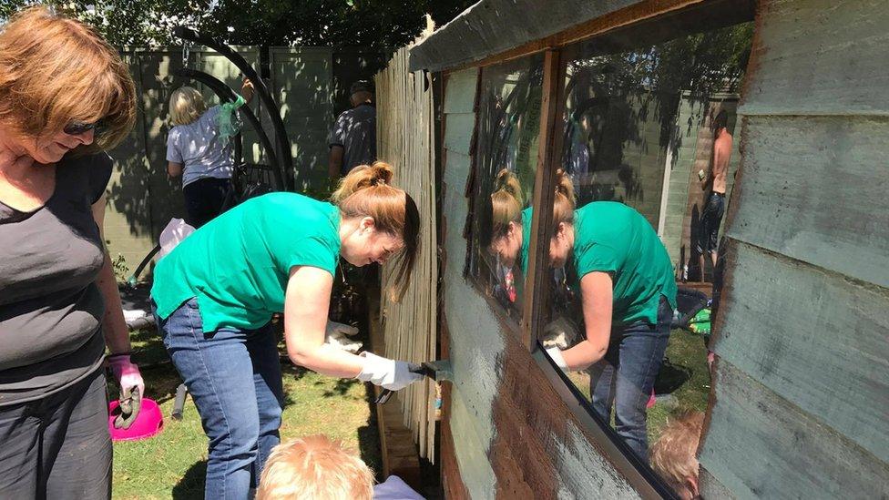 Volunteers working on Darren Black's garden