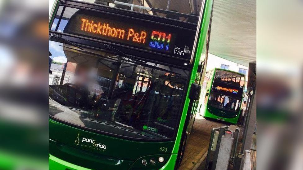 A Norwich Park and Ride bus with rainbow coloured numbers.