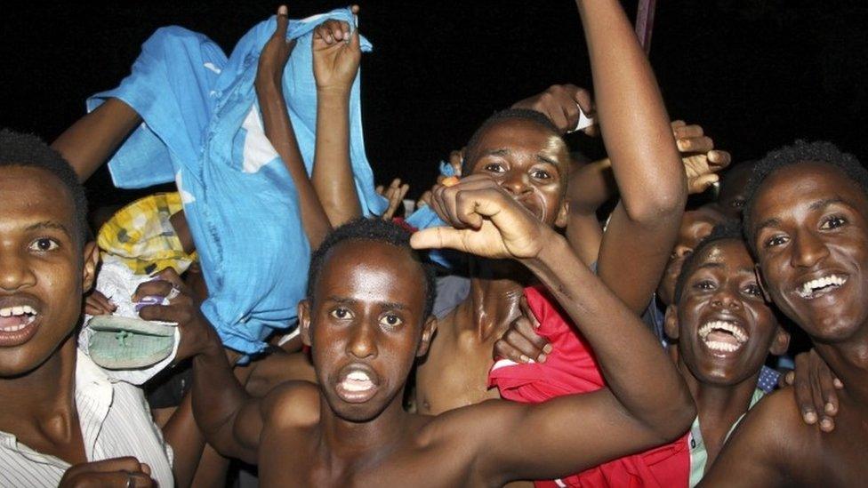 Young men celebrating election