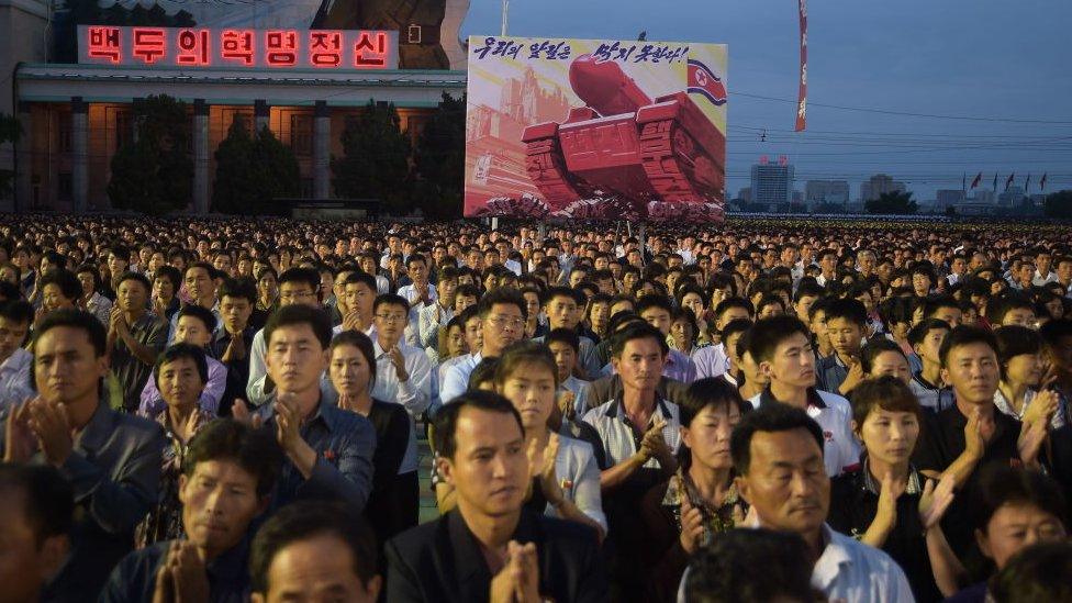 This photo taken on September 6, 2017 shows participants of a mass celebration in Pyongyang for scientists involved in carrying out North Korea's largest nuclear blast to date.