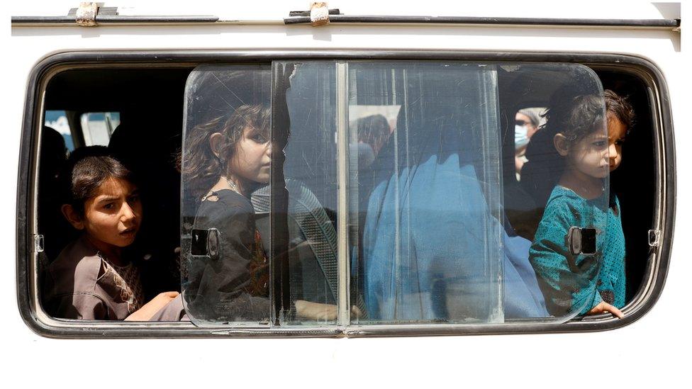 Afghan children ride in a vehicle as they flee their houses following heavy fighting in Ghazni Province, on the Ghazni - Kabul highway, Afghanistan August 14, 2018.