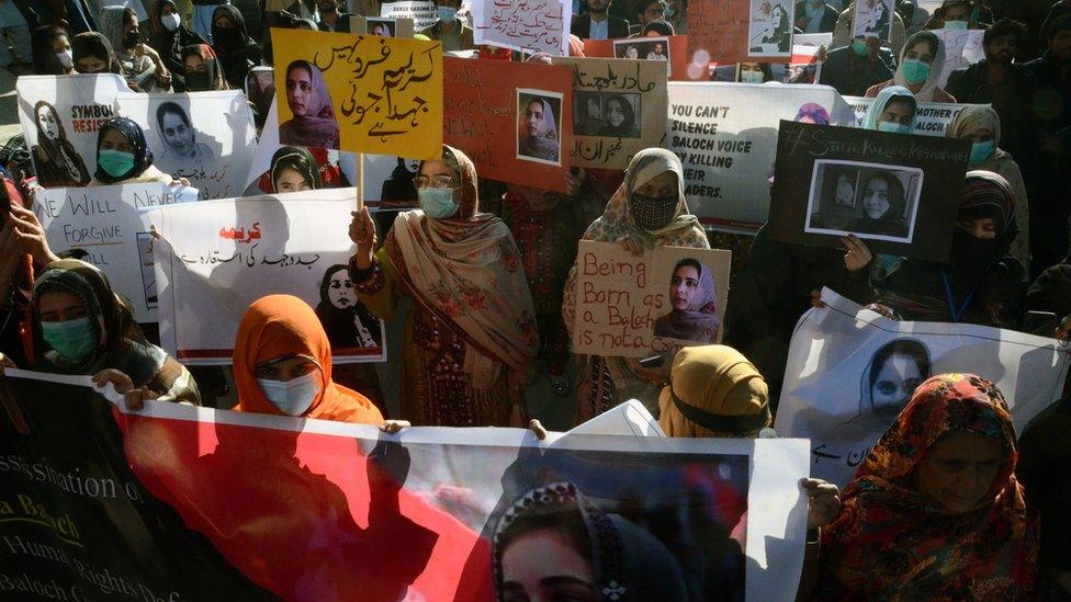 Supporters of Baloch political activist Karima Baloch hold her pictures during a rally to mourn her killing, in Quetta, the provincial capital of Balochistan province, Pakistan, 23 December 2020.