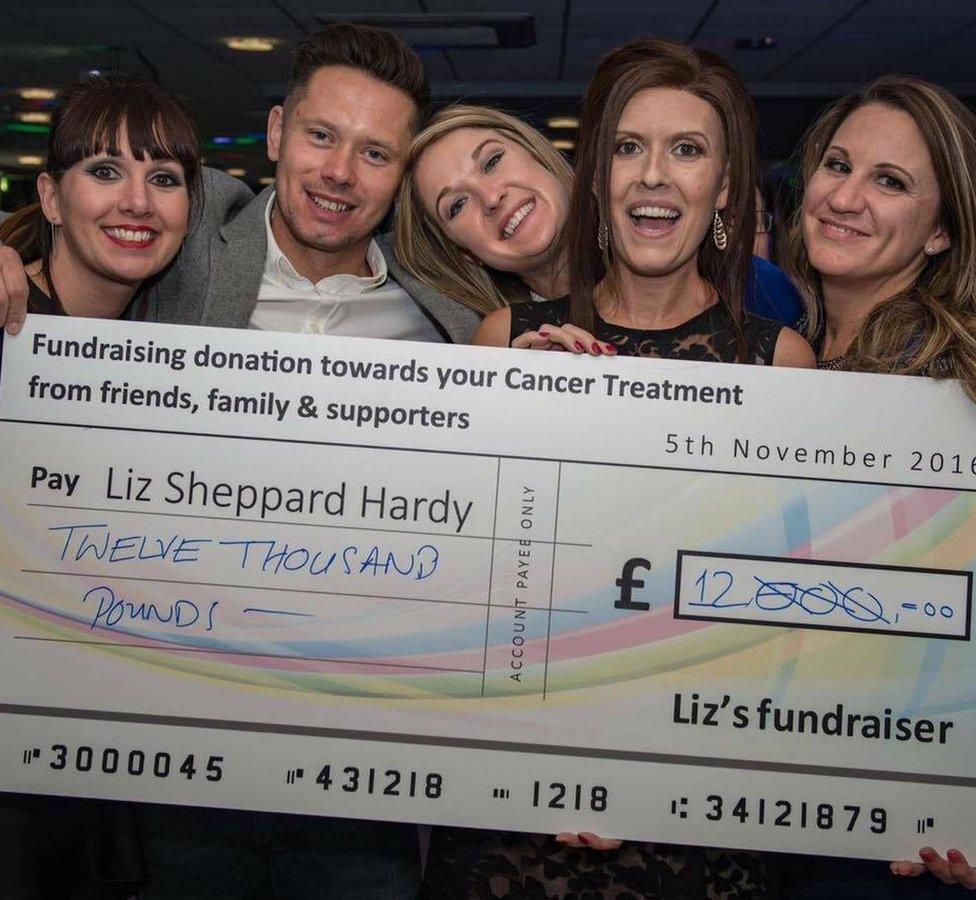 Liz Sheppard holding cheque