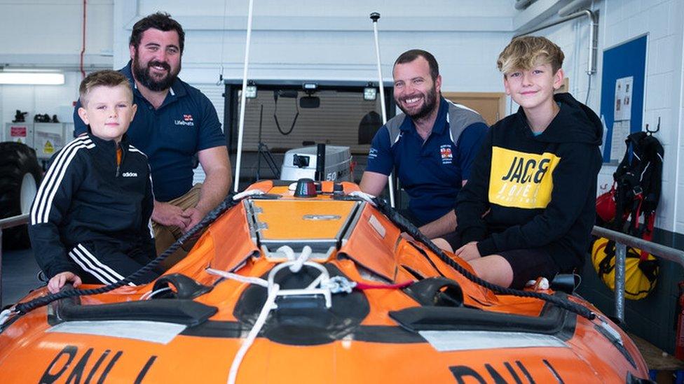 Dexter and Theo with members of the RNLI team