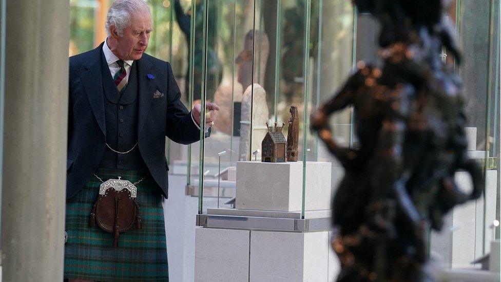 King Charles looks at a 13th Century casket commemorating the death of St Thomas Becket