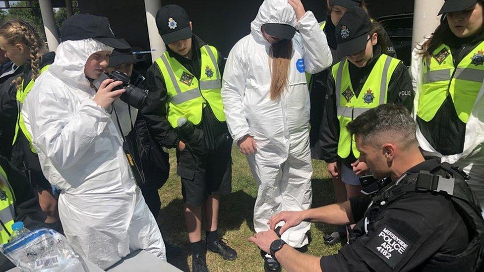 mini police unit being trained by police officer