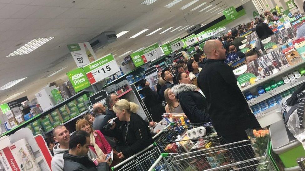 Customers waiting at Asda tills in Reading