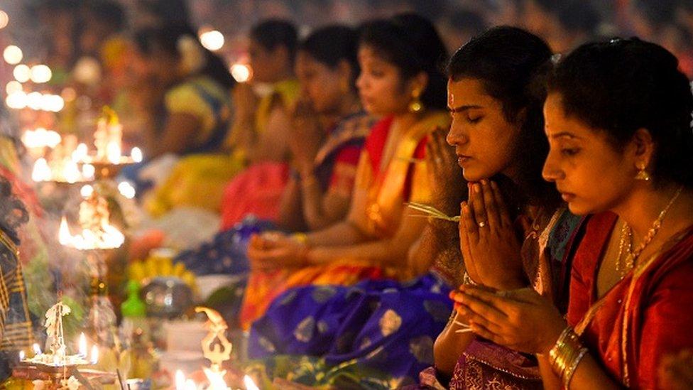 Worshippers offer prayers at a Hindu temple in Colombo, Sri Lanka