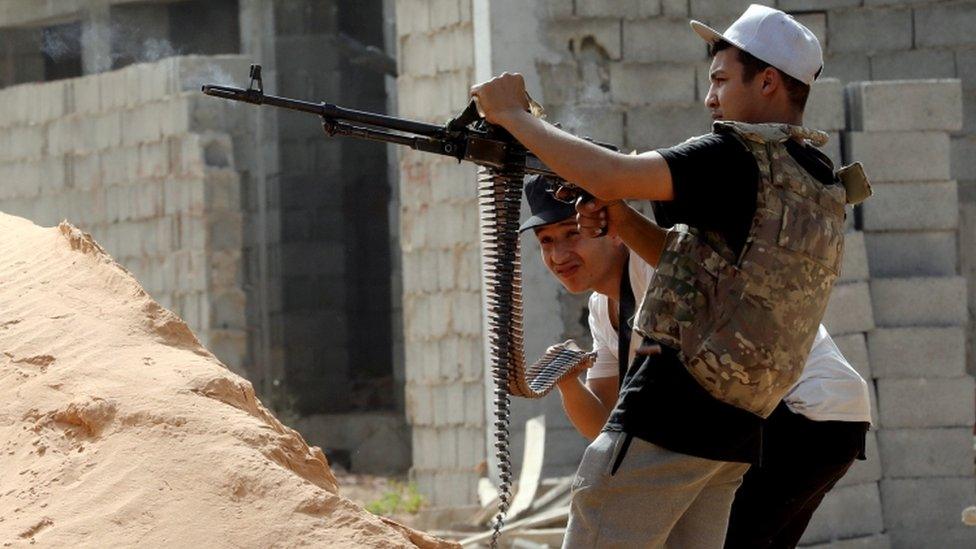 A member of the Libyan internationally recognised government forces fires during a fight with Eastern forces in Ain Zara, Tripoli, Libya April 25, 2019