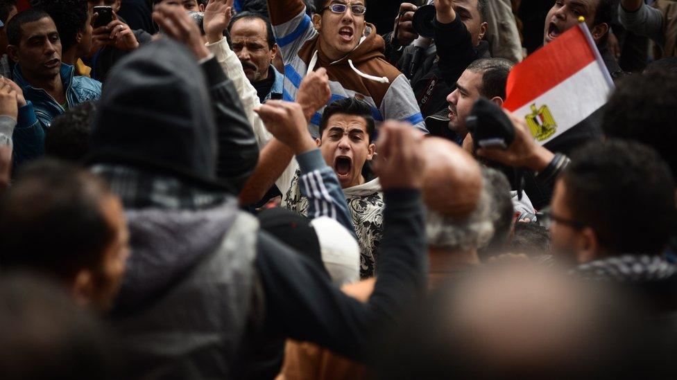 Egyptian protesters shout slogans during a demonstration against President Abdel Fattah al-Sisi and marking the fourth anniversary of the 2011 uprising, on 25 January 2015