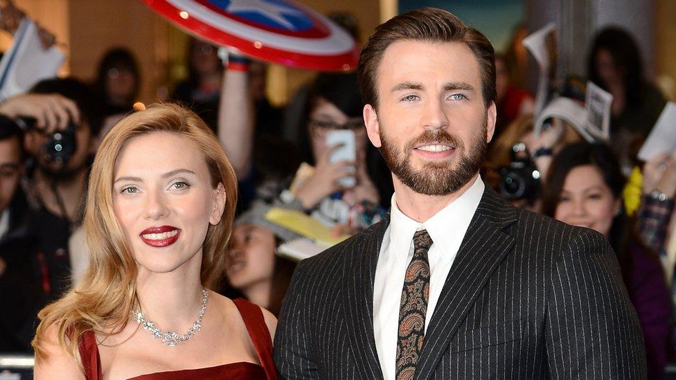 Scarlett Johansson and Chris Evans on the carpet before the Captain America: The Winter Soldier premiere.