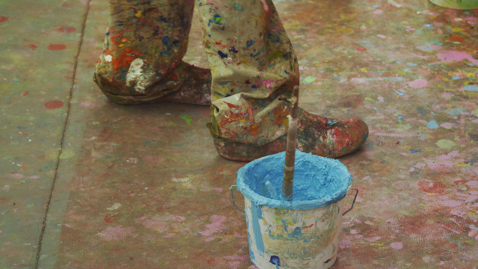 Damien Hirst's paint-flecked shoes and paint pot, © Damien Hirst and Science Ltd. All rights reserved, DACS 2021