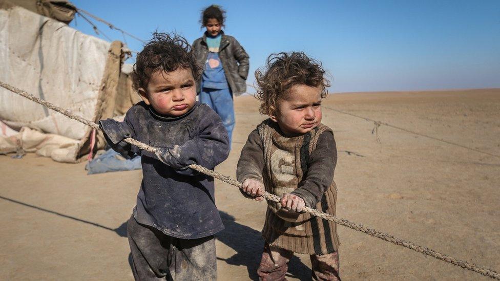 Displaced Syrian children who fled Raqqa city stand near their tent in Ras al-Ain province, Syria January 22, 2017