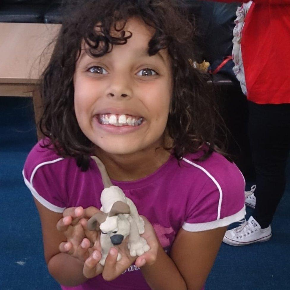 Giorgia holding a Gromit model she made