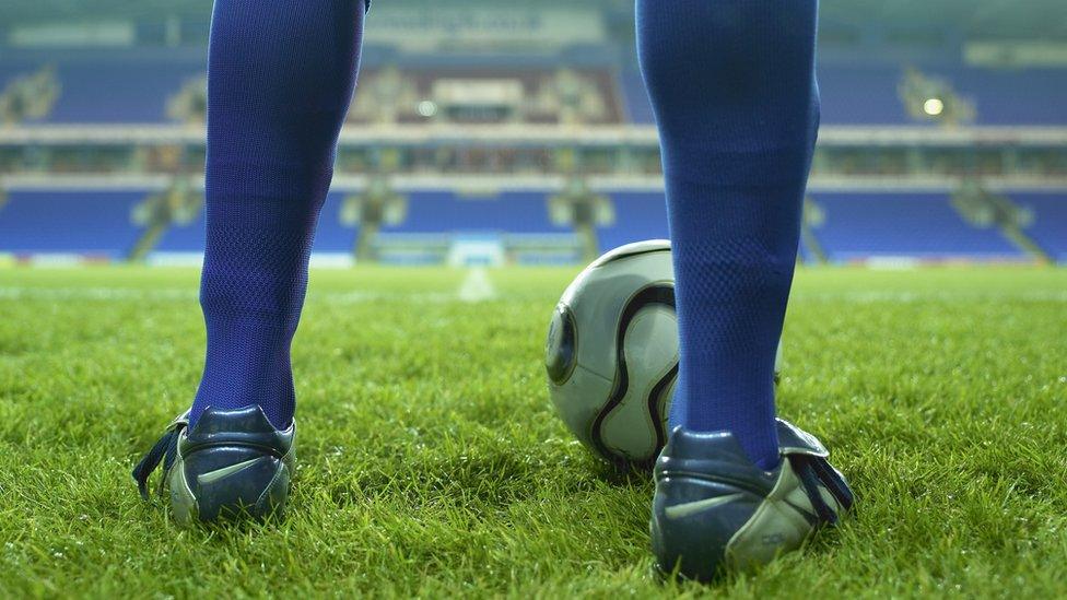 Young football player on a pitch