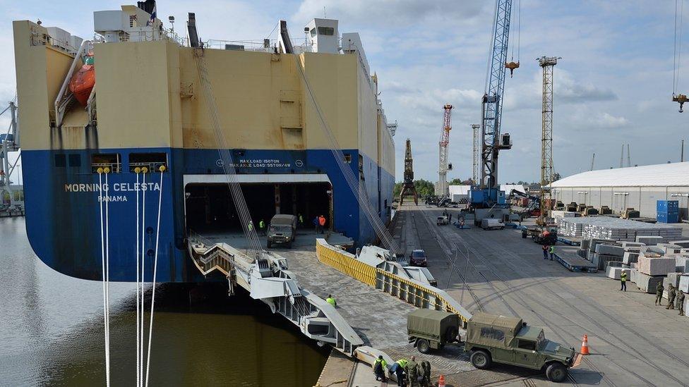 Vehicles of Nato's "Spearhead" force disembark on arrival from Spain at the port of Szczecin, Poland