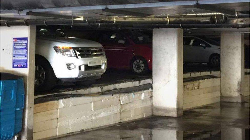 Damaged cars in underground car park