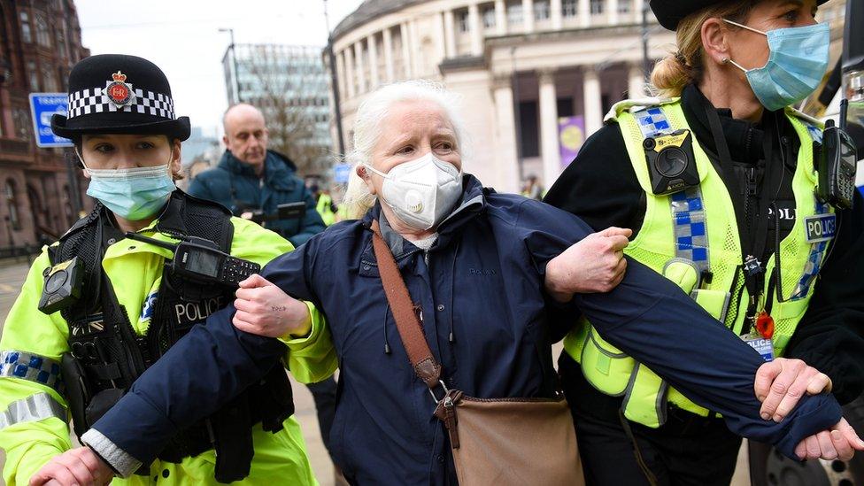 Protester arrested by two police women