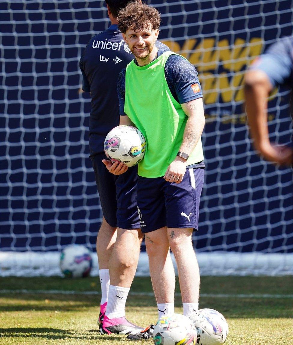 Tom Grennan smiling at training.