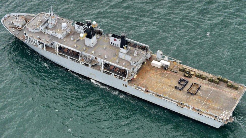 Members of the ship's company on HMS Bulwark created a "90" on the flight deck of the amphibious assault ship