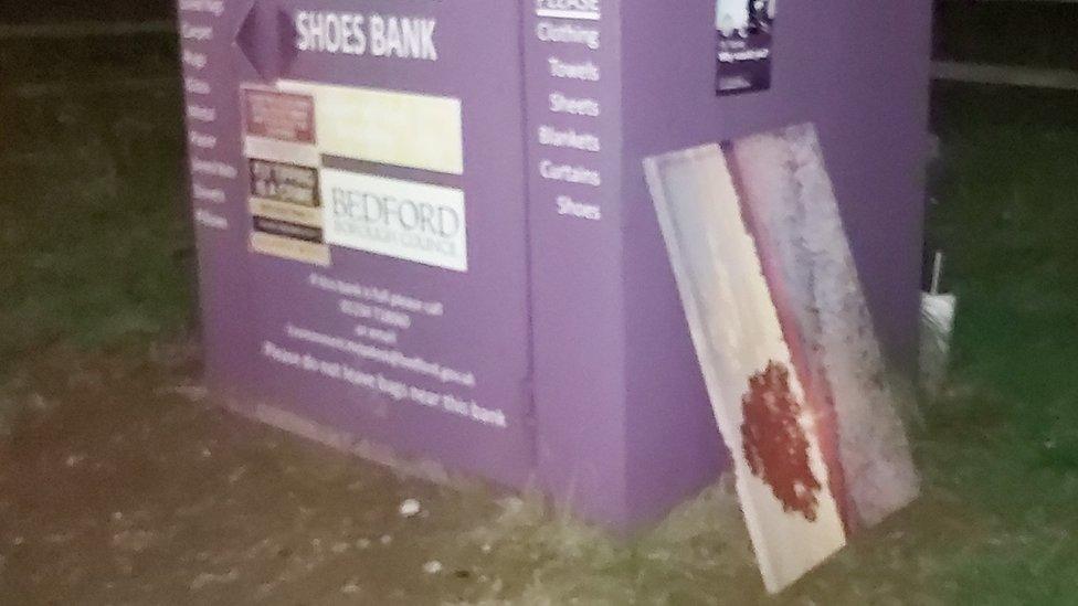 A painting left by the side of a clothes and shoe collection point in Great Denham, Bedfordshire