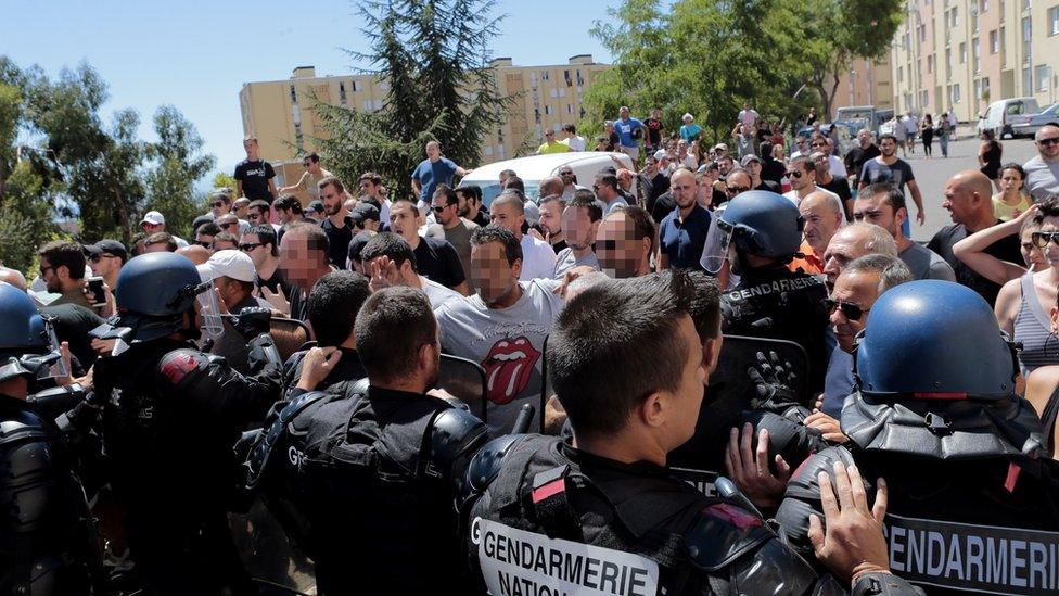 Protesters push up against police in Bastia, Corsica, 14 August