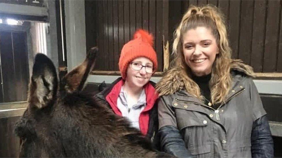 Anna with Helen Patterson, from Cancer Fund for Children, visiting a donkey sanctuary