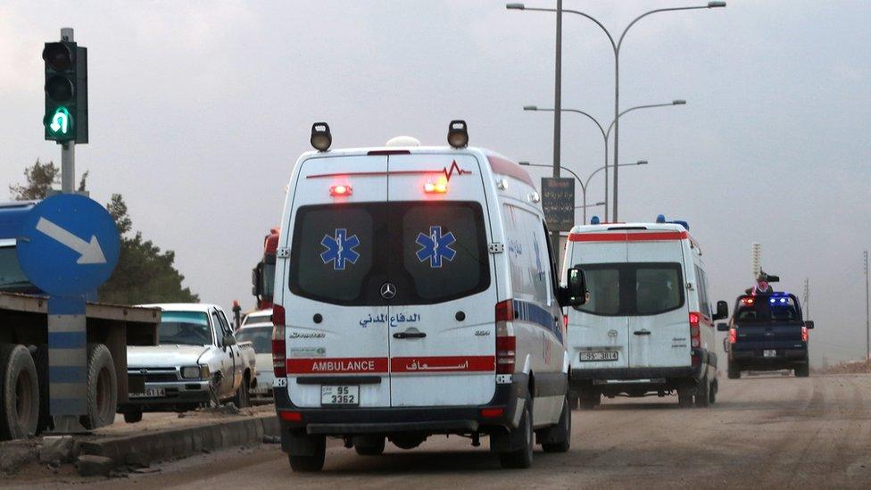 Ambulances leave the King Abdullah bin Al Hussein Training Centre in Muwaqqar on the outskirts of Amman, Jordan, on Monday.