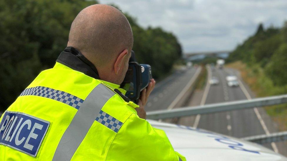 Man with speed camera