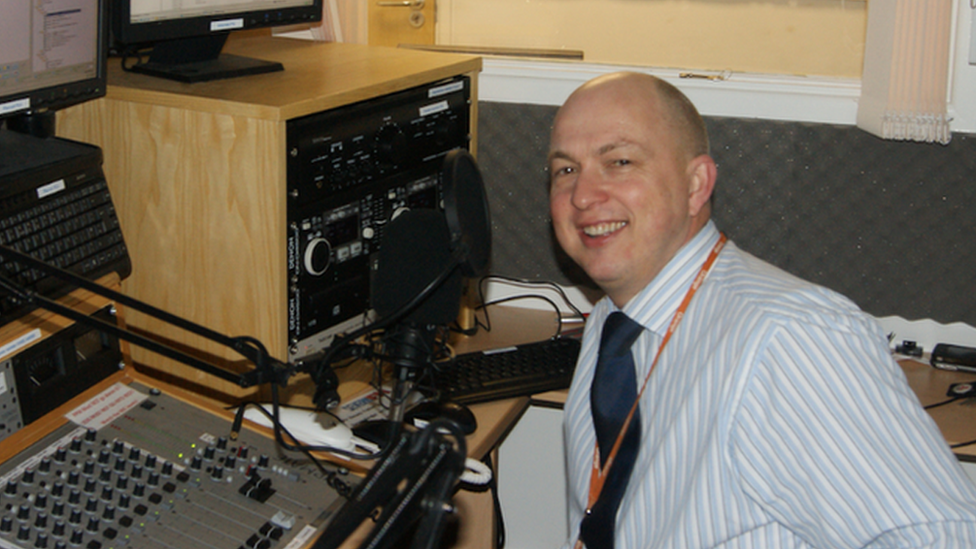 Andy Clarke seen sitting in his radio studio