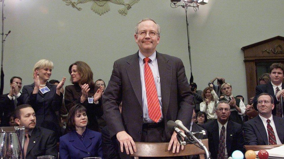 Independent Counsel Ken Starr stands after testifying during Bill Clinton impeachment hearings.