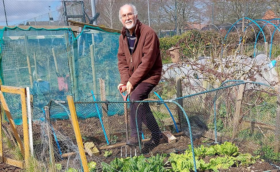 Roger Bridgeman with his garden fork at his plot on the allotments at Kingston Field, Woodbridge