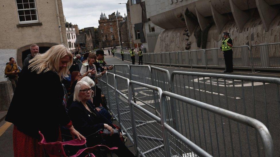 Crowds gather on the route of the cortege in Edinburgh