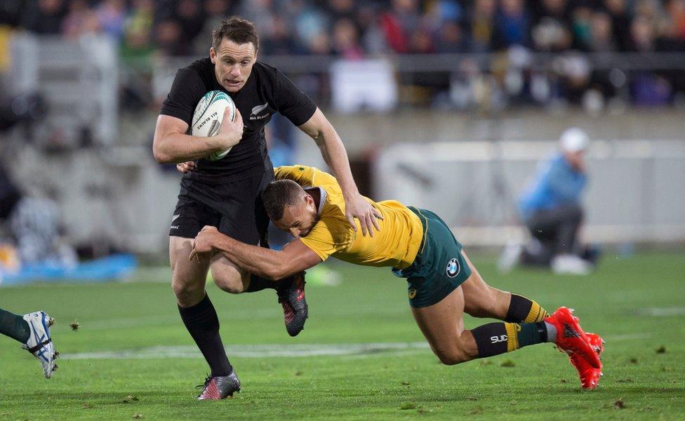 All Blacks Ben Smith, left, is tackled by Australia's Quade Cooper during the Rugby Championship test played at Westpac Stadium in Wellington, New Zealand, 27 August 2016.