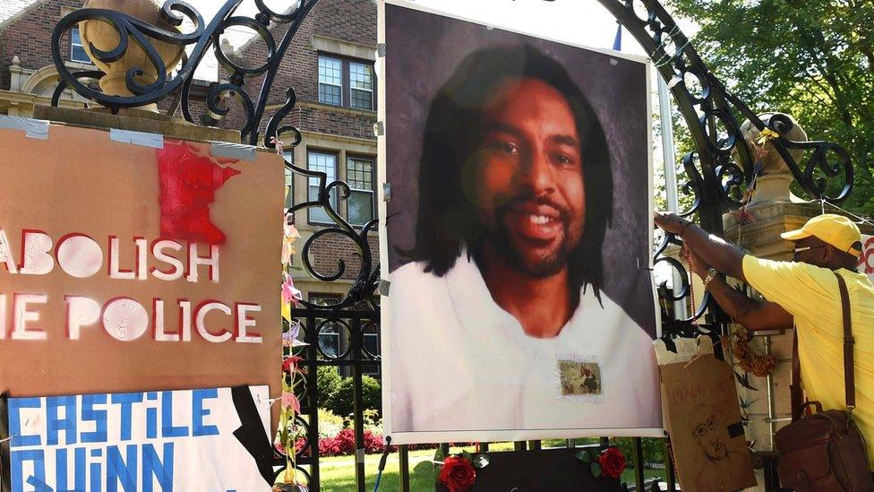 Protesters hang image of Philando Castile on gates of governor's residence in St Paul, Minnesota. 24 July 2016