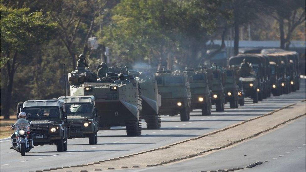 A military convoy is seen at the main entrance of Esplanada dos Ministerios, in the city of Brasilia, Brazil, 10 August 2021