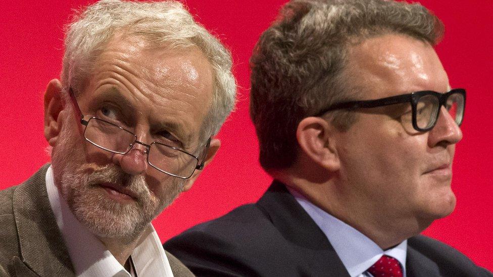 Labour leader Jeremy Corbyn (l) and deputy leader Tom Watson (r) sit on stage during the annual Labour Party conference in Brighton