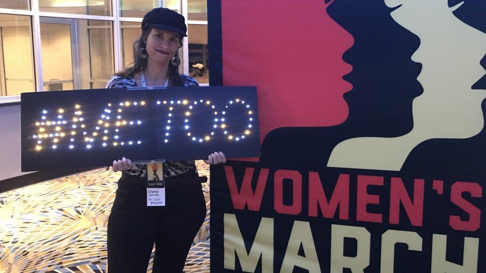 Athena Soules holds up her "#metoo" sign