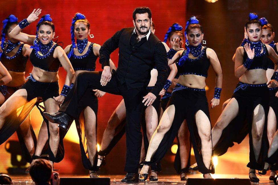 Salman Khan (C) performs on stage during an Indian film awards ceremony in New Jersey in 2017