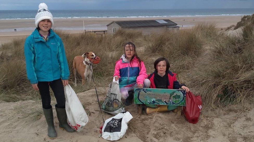 Pearson sisters with litter and sign