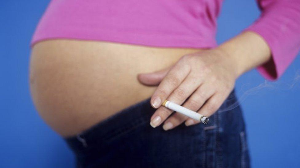 Woman smoking while pregnant