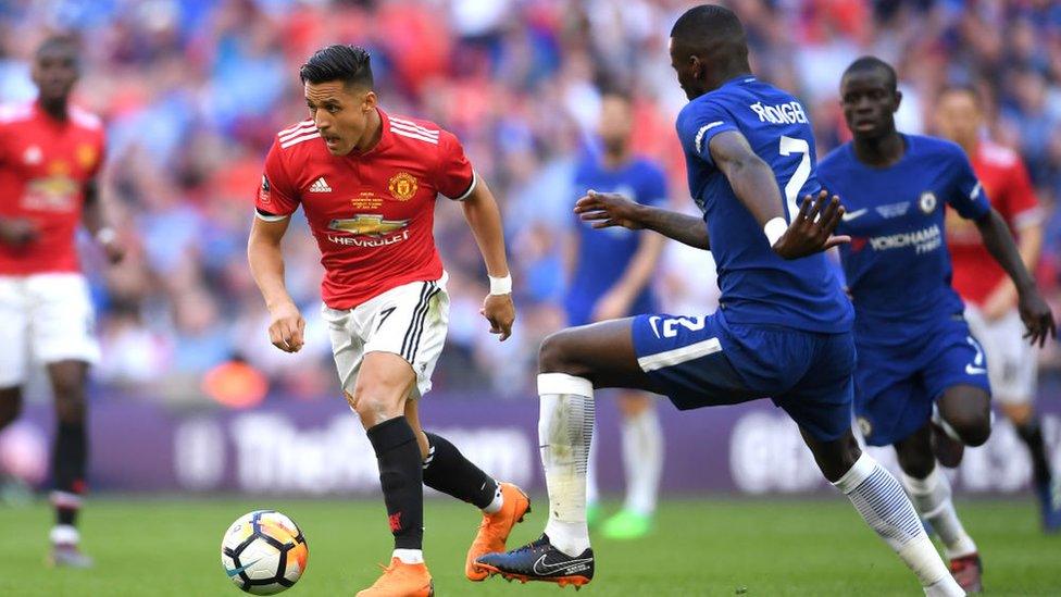 Alexis Sanchez of Manchester United runs with the ball under pressure from Antonio Rudiger of Chelsea during The Emirates FA Cup Final between Chelsea and Manchester United at Wembley Stadium on May 19, 2018 in London, England.