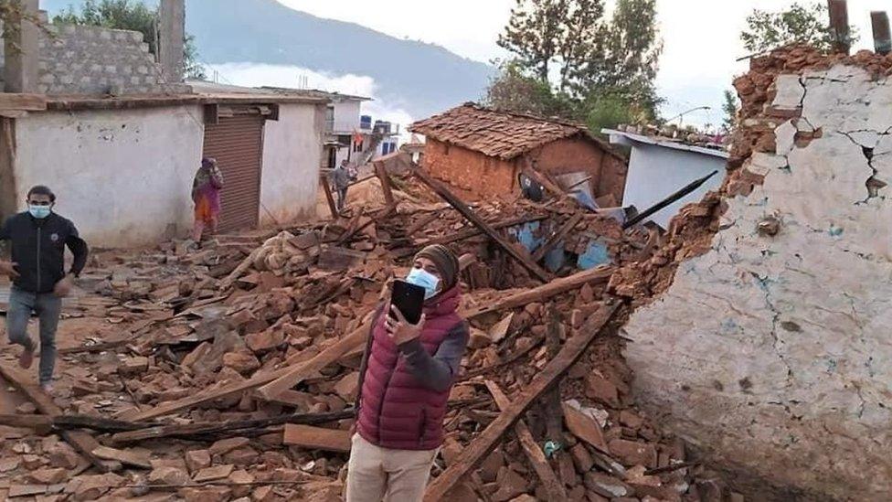 Houses damaged by an earthquake on Friday