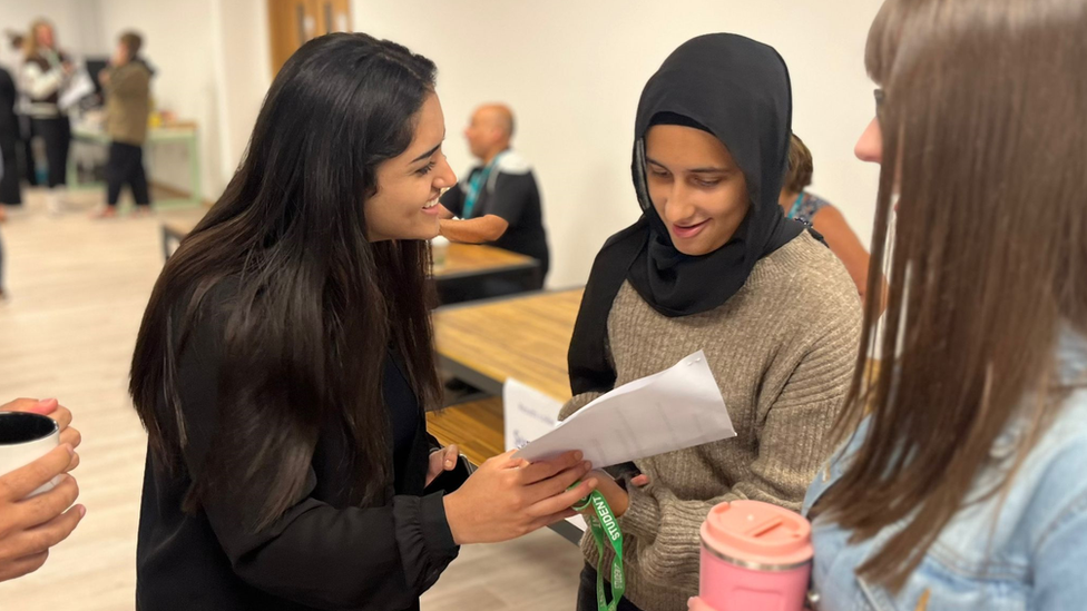 Students look at their results