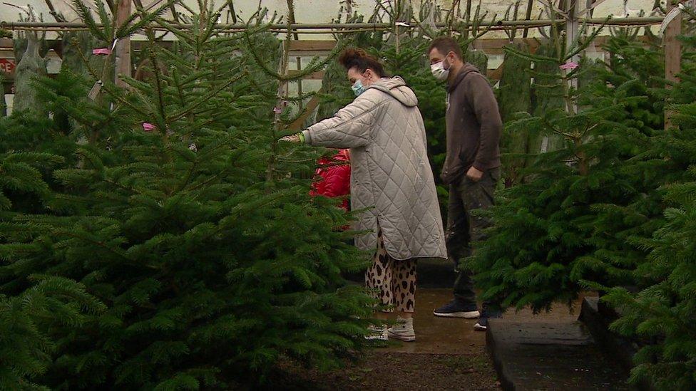 Family with Christmas tree