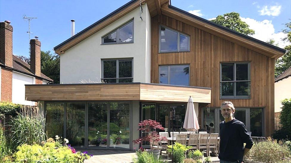 Colin Heal in front of his award winning home