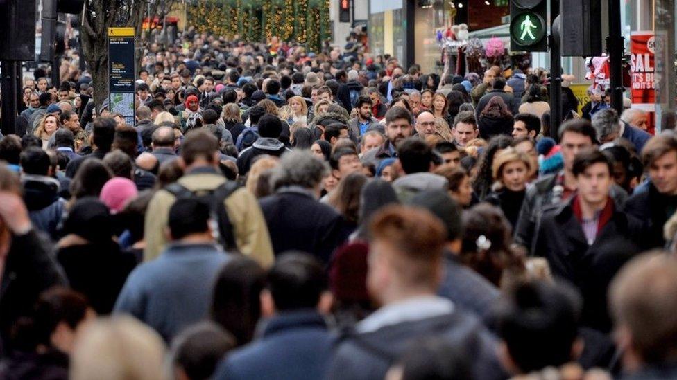 Crowds of people in city centre