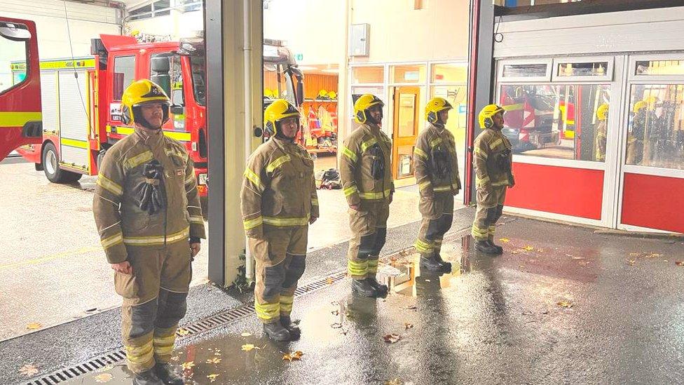 Firefighters at Rugby holding their tribute